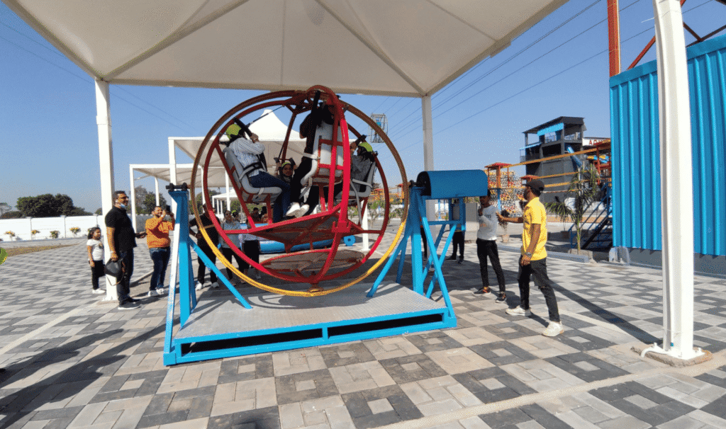 Adventure park setup in Shimla with zipline rope course and climbing activities