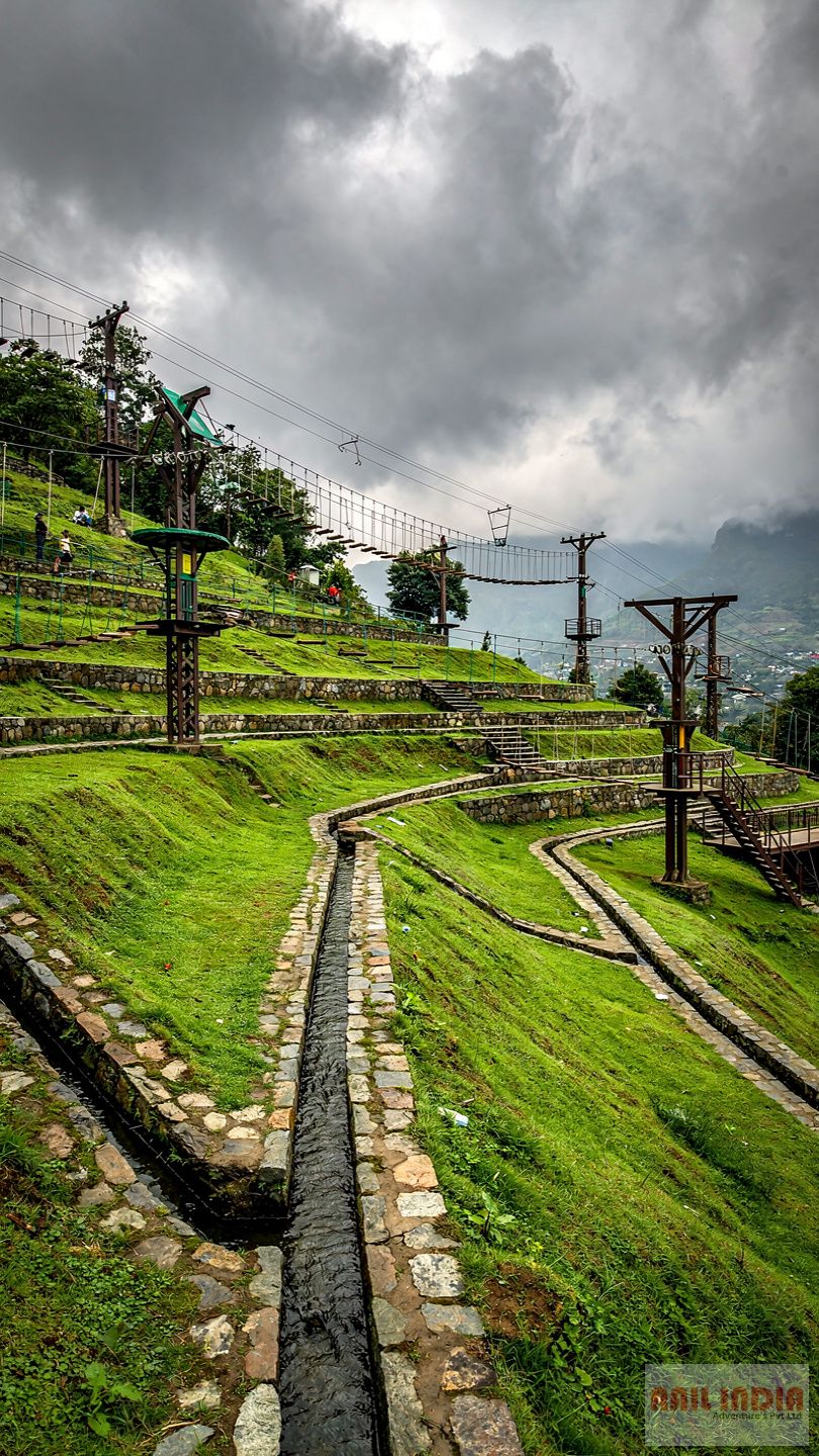 Adventure park in hill station monsoon with drainage and safety setup